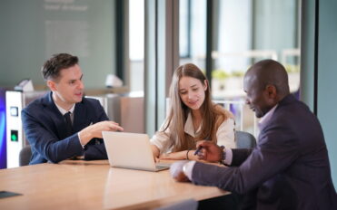 Business people in the workplace are discussing a working strategy for doing business
