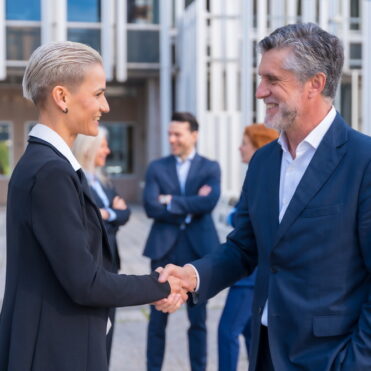 Handshake of Successful Business Executives in a Downtown Area